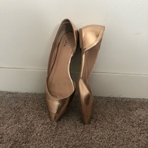 Rose gold pointed flats